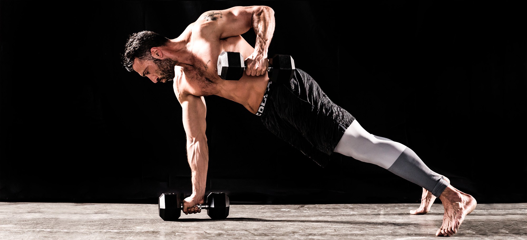 Athlete exercising using Sidea Hex Dumbbells