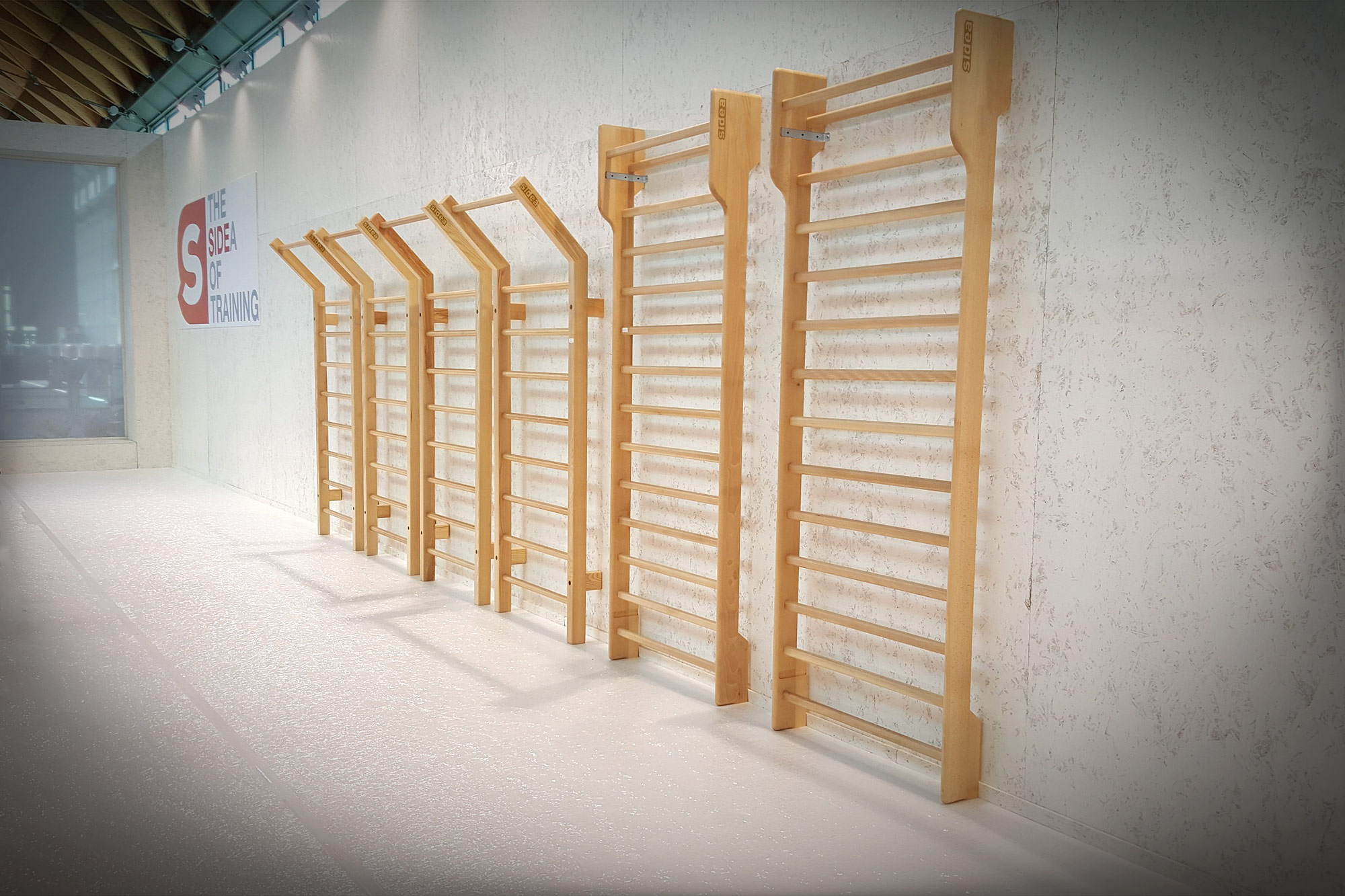 Sidea wooden gym wall bars and stall bars installed in a commercial fitness facility